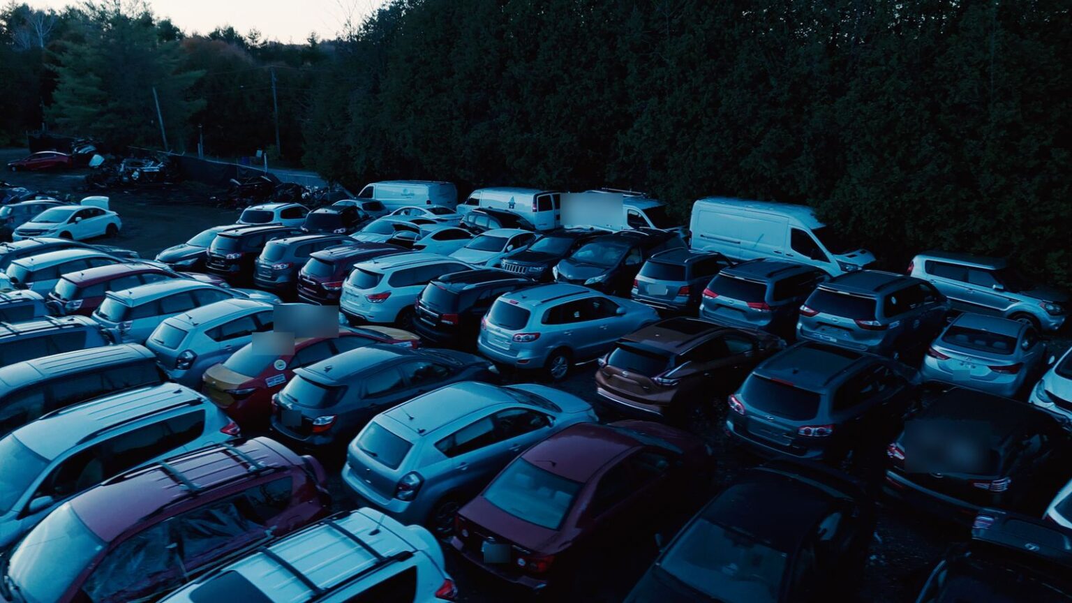 SUVs, hatchbacks and work vans lined up at the GTA Auto Recycling yard in Newcastle, Ontario